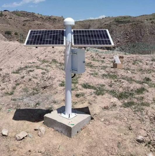 GNSS monitoring station on a concrete pier with solar panels